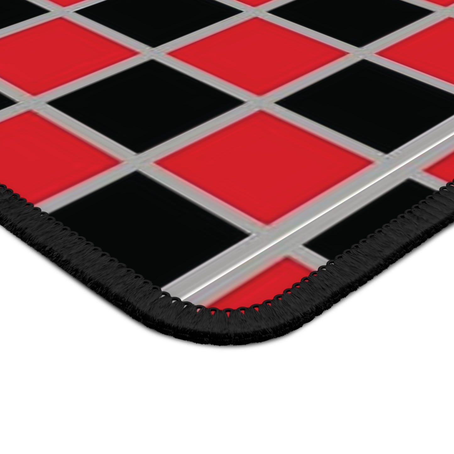 Checkered mat with red and black squares on a white background