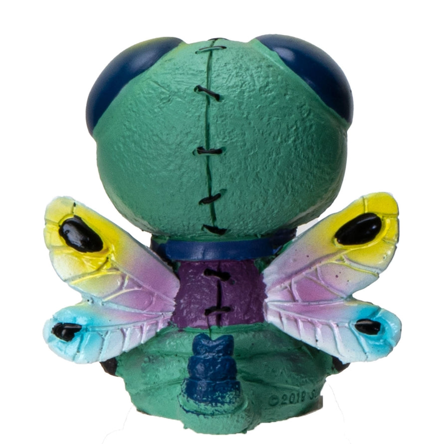 Toy figure with a green head and colorful butterfly wings on a white background