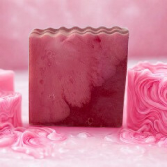 Pink soap bar with a wavy texture on a pink background