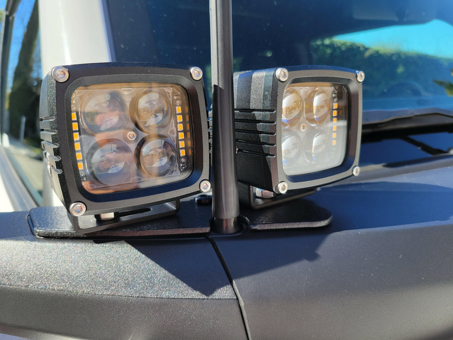Two off-road lights mounted on a vehicle's roof