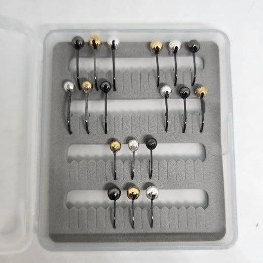Set of fishing hooks in a clear plastic container with gray foam lining.