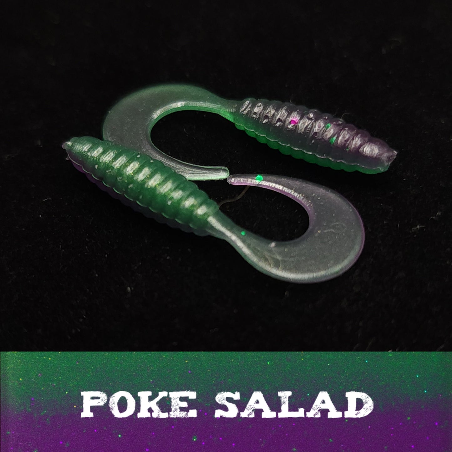 Two fishing lures with a 'Poke Salad' label on a dark background