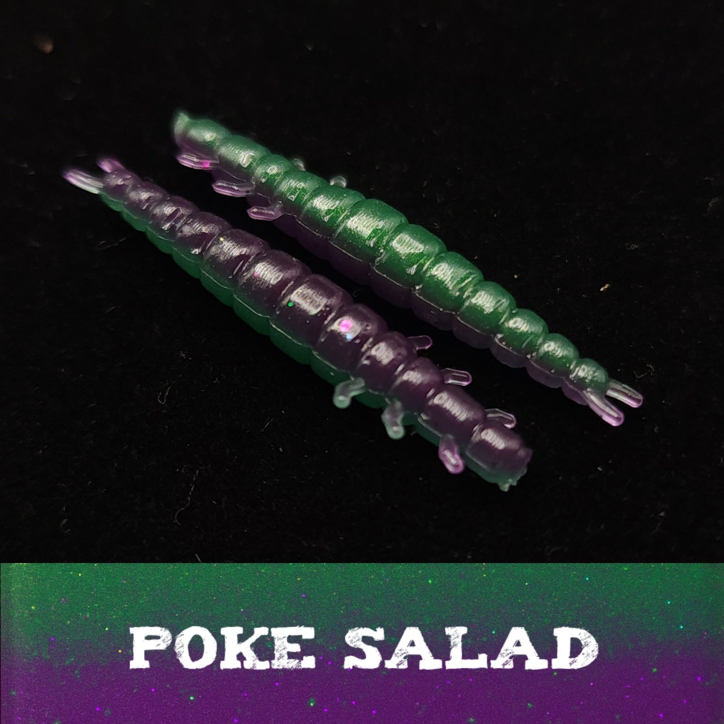 Two purple and green worm-like objects on a black background with 'POKE SALAD' text.