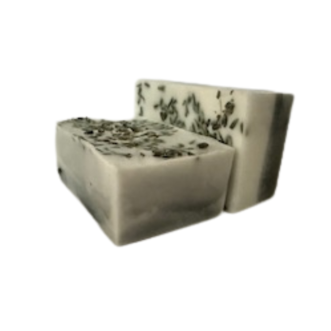 Block of lavender and charcoal soap on a white background