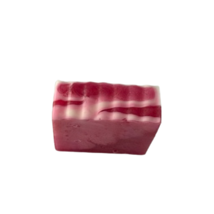 Bar of Blush & Bloom Rose Swirl Handmade Soap with red and white stripes on a white background