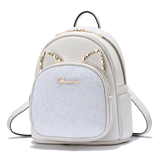 White backpack with glittery front panel and cat ear design on a white background