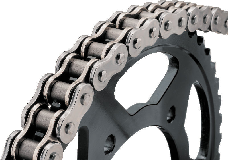Close-up of a motorcycle chain and sprocket on a white background