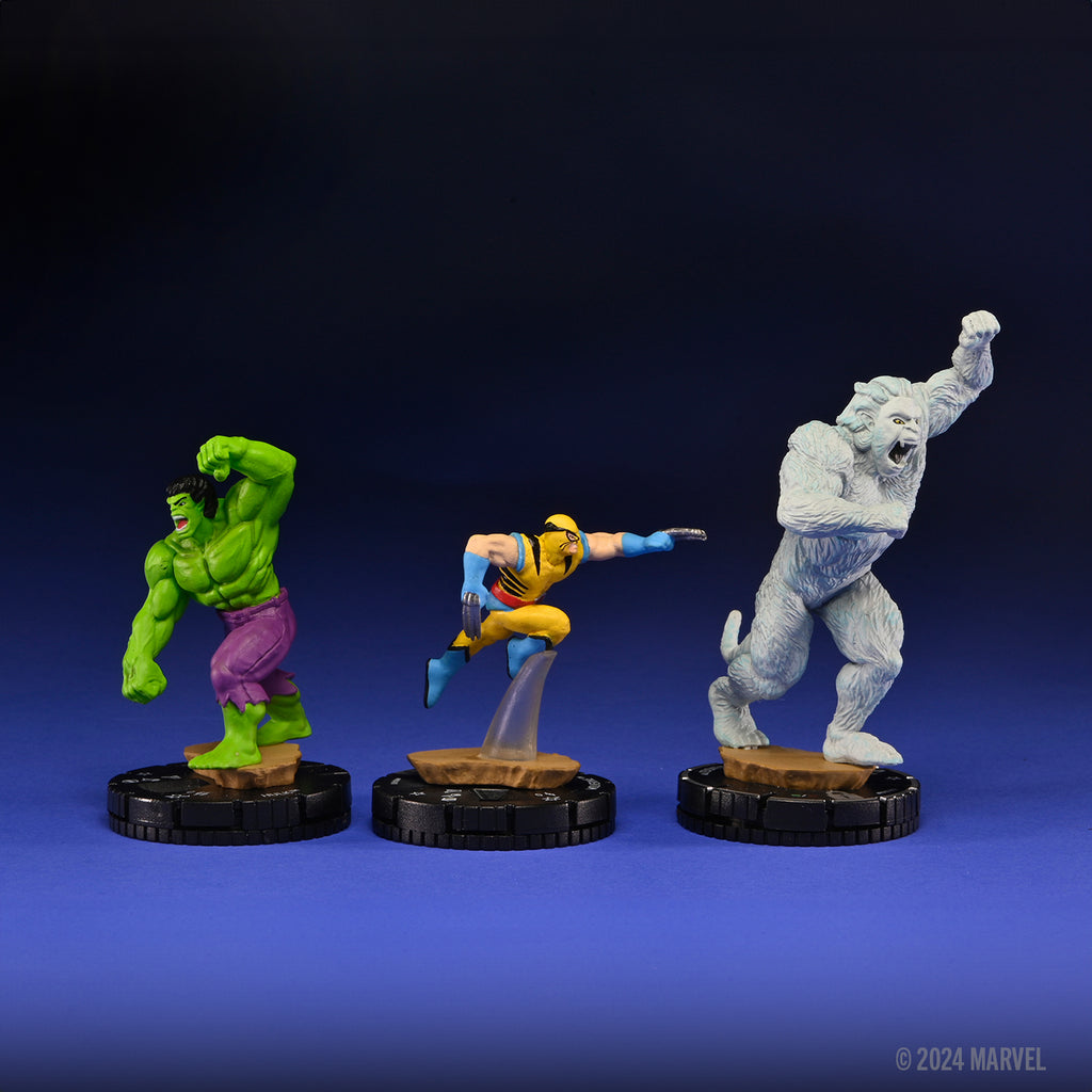 Three superhero figurines on a blue and black gradient background with Marvel logo.