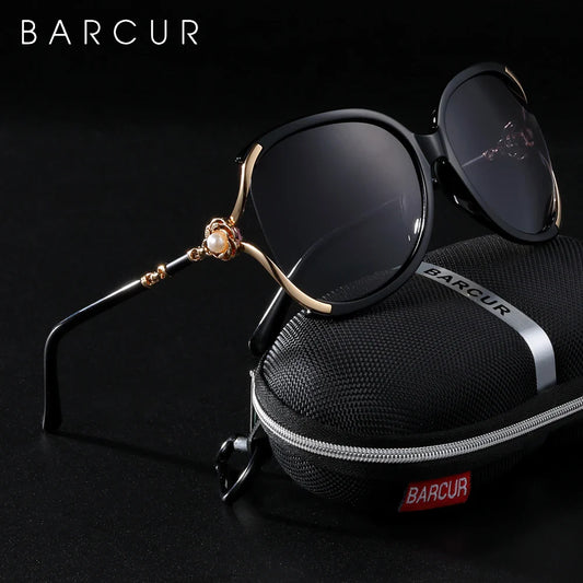 Barcur sunglasses with a black case on a dark background