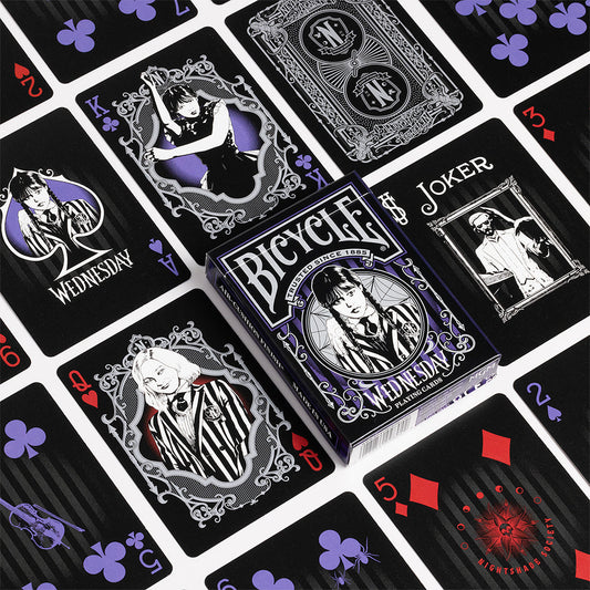 Bicycle Wednesday playing cards with black and purple design on a grid of other cards.