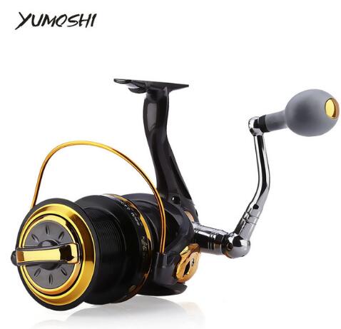 Fishing reel with gold accents on a white background, featuring the brand 'YUMOSHI'.
