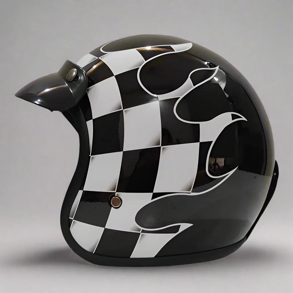 Black and white checkered helmet with flame design on a gray background
