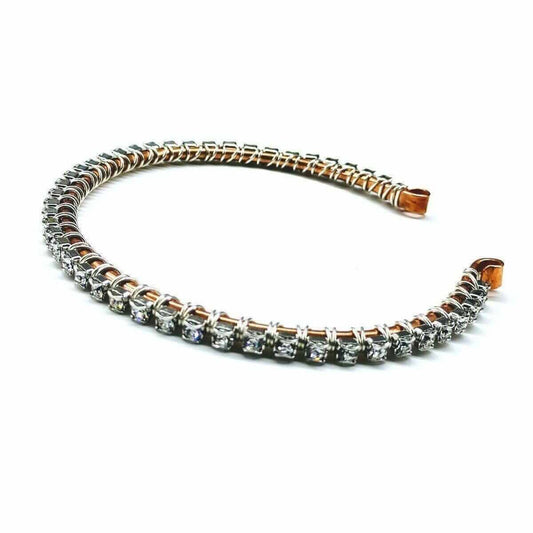 Bracelet with rose gold and silver accents on a white background