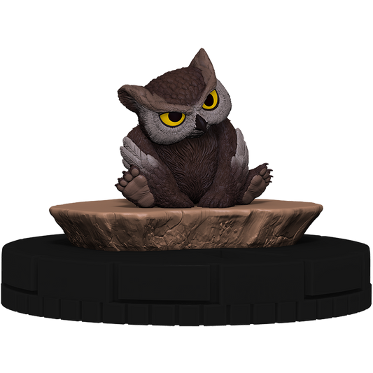 Owl figurine on a rock-like base with a white background