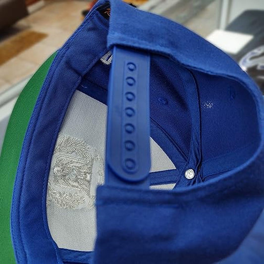 Close-up of a blue cap with a brand logo on a blurred background