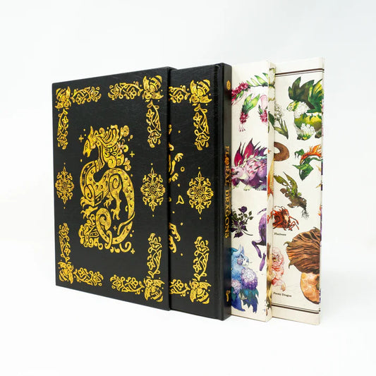 Two books with decorative covers, one black with gold dragon design, the other with floral and nature-themed cover.