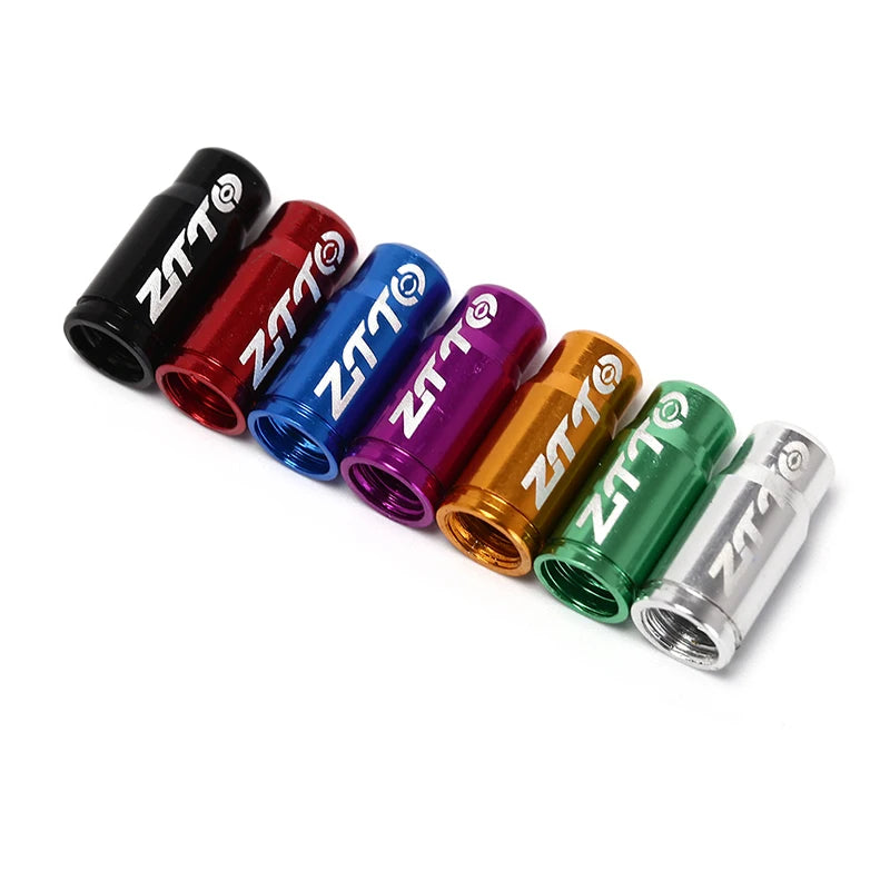 Set of ZTTO bicycle quick release valve covers in various colors on a white background