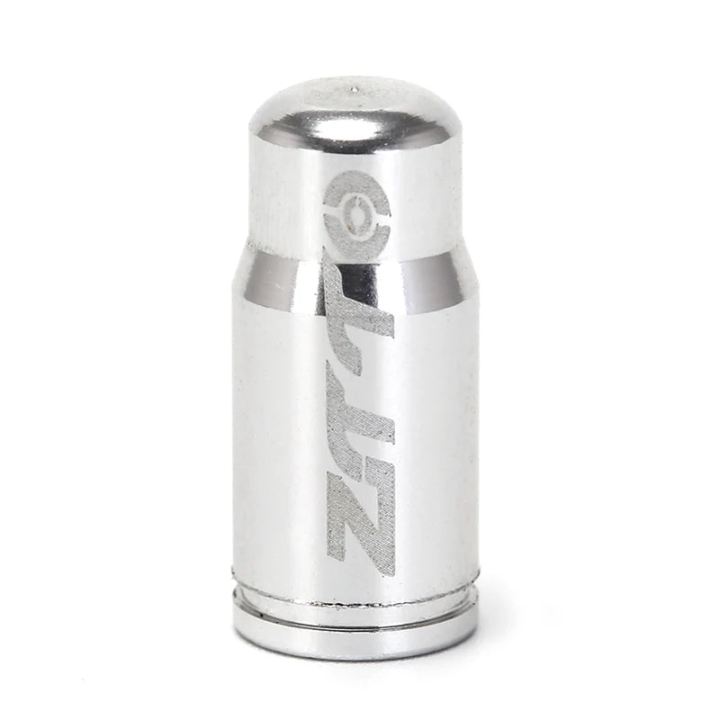 Silver cylindrical valve cover with 'Zeta' branding on a white background