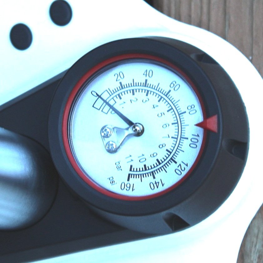 Close-up of a pressure gauge with a blurred background
