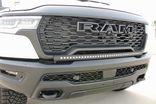 Close-up of a Ram truck grille with LED light bar