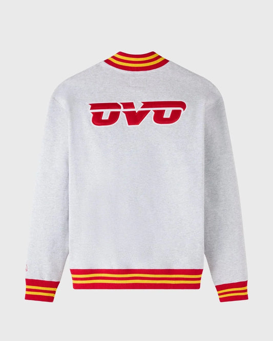 White sweater with red and yellow accents on a white background