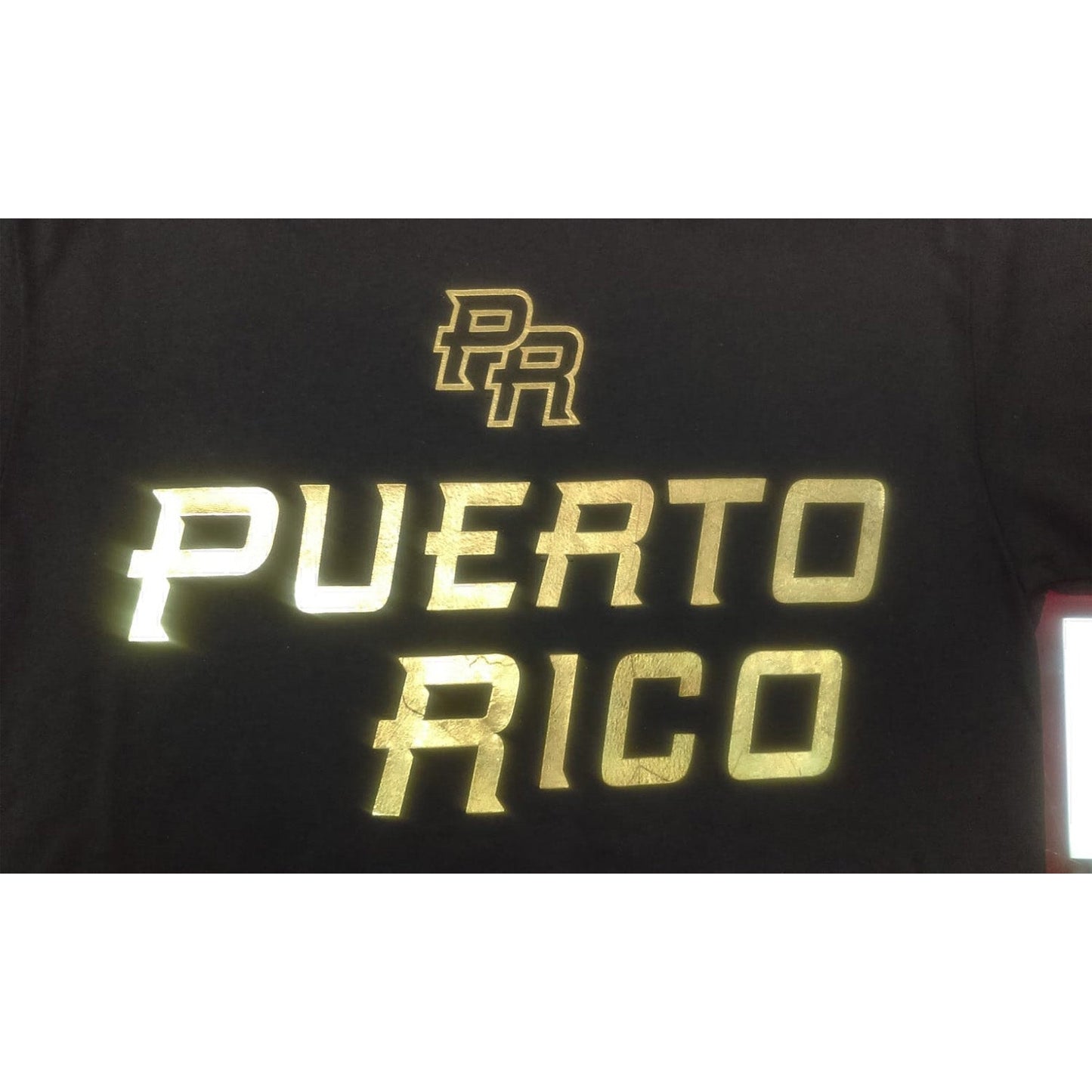 Black shirt with gold 'PR' and 'Puerto Rico' text on a white background