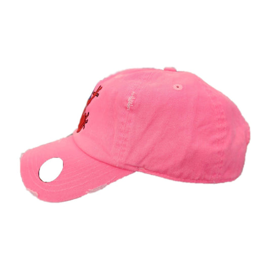 Pink baseball cap with a small logo on a white background