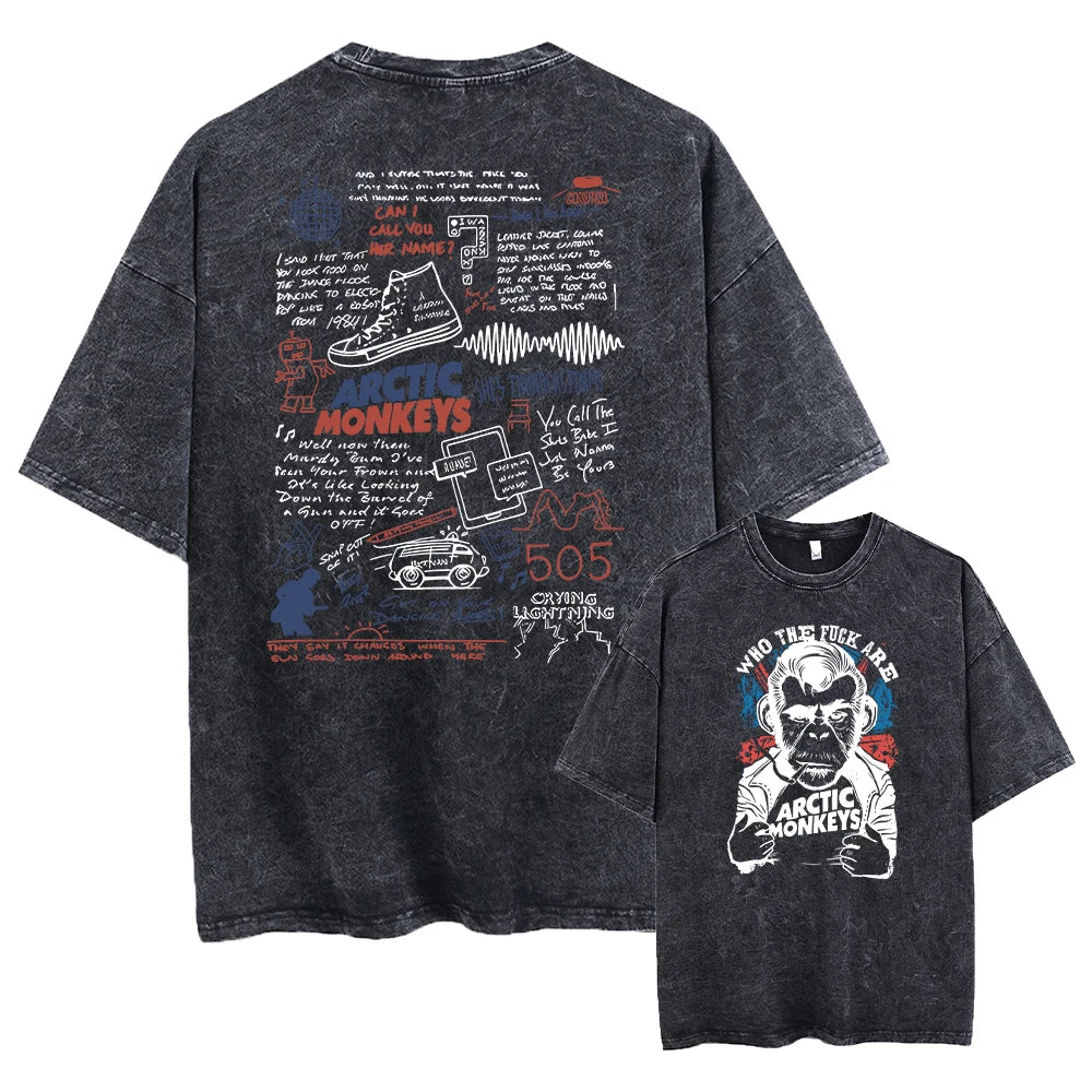 Black t-shirt with graphic designs and text on the front and back, featuring the Arctic Monkeys brand.