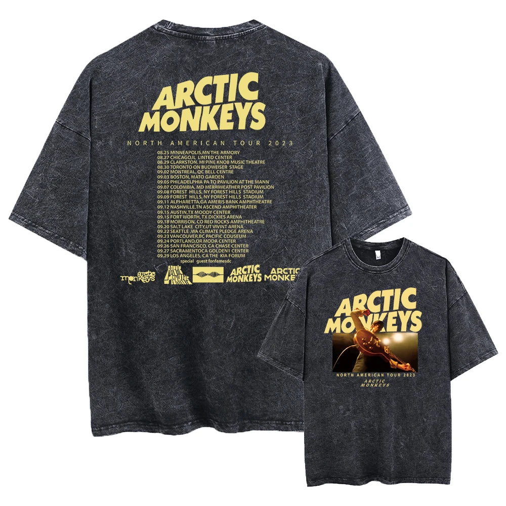 Black t-shirt with 'Arctic Monkeys' branding and tour information on a white background