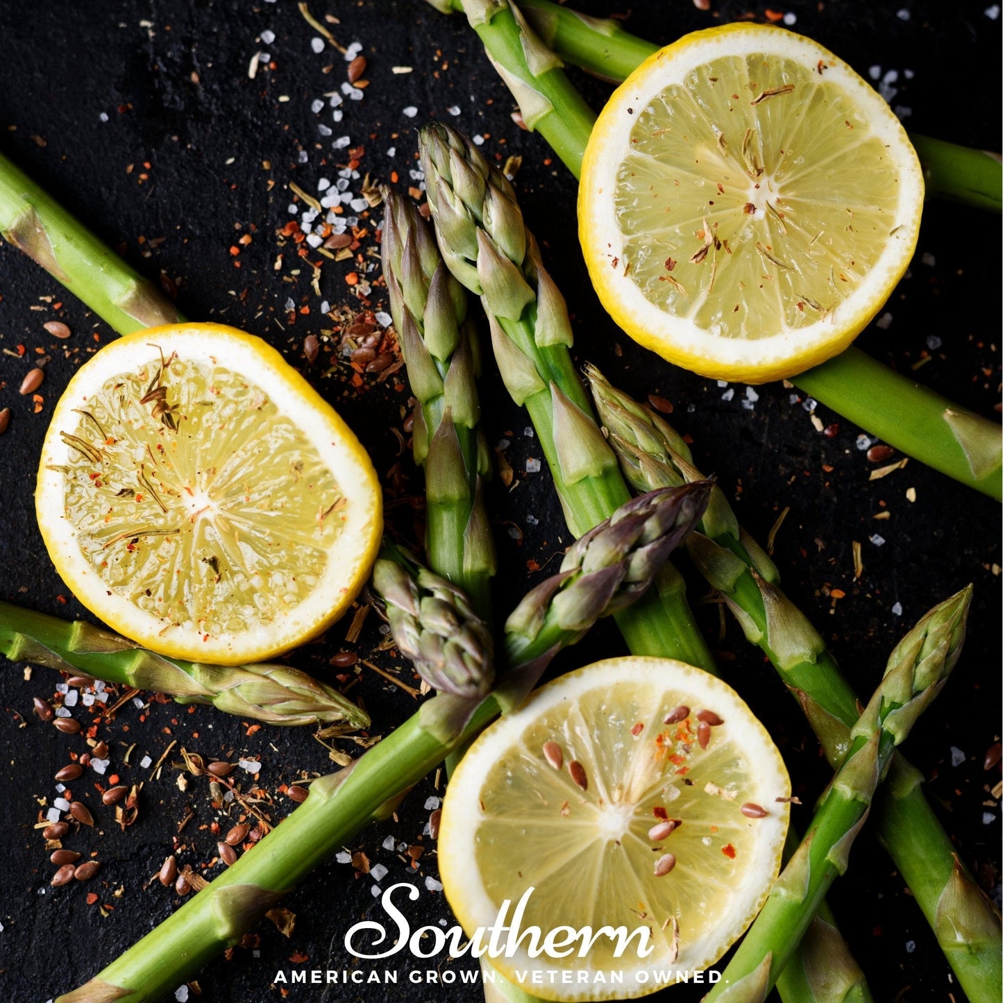 Green asparagus spears with lemon slices on a dark surface, featuring the 'Southern' brand.