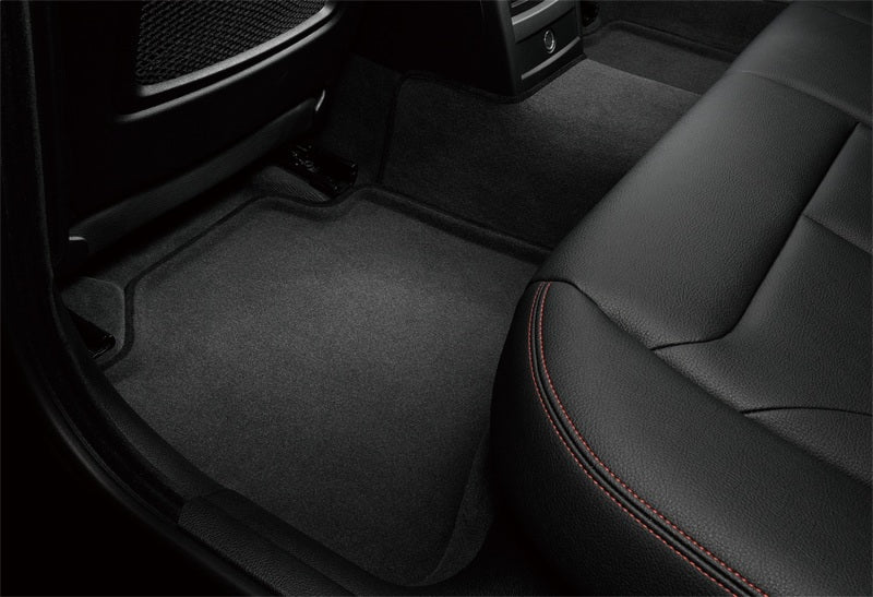 Car interior with black floor mat and seat
