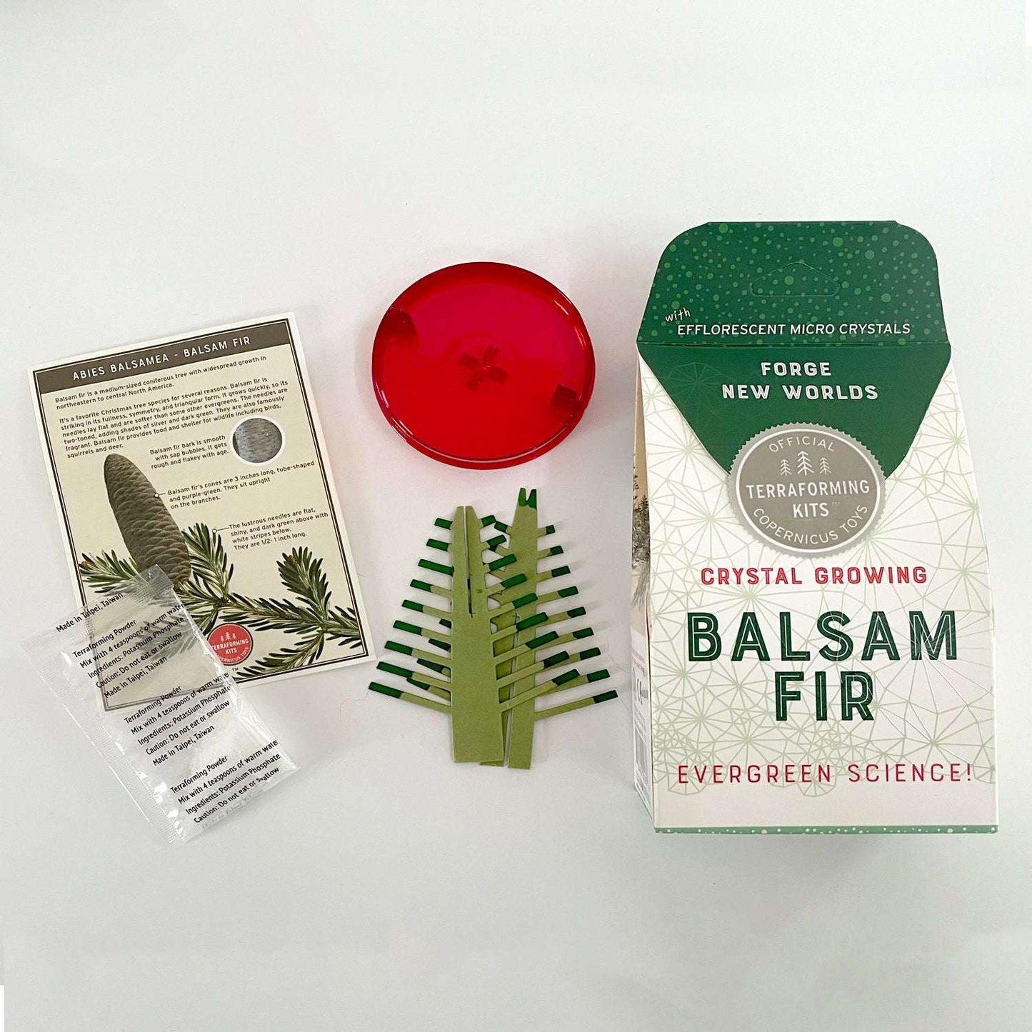 Crystal growing kit for Balsam Fir with packaging, crystals, and instructions on a white background