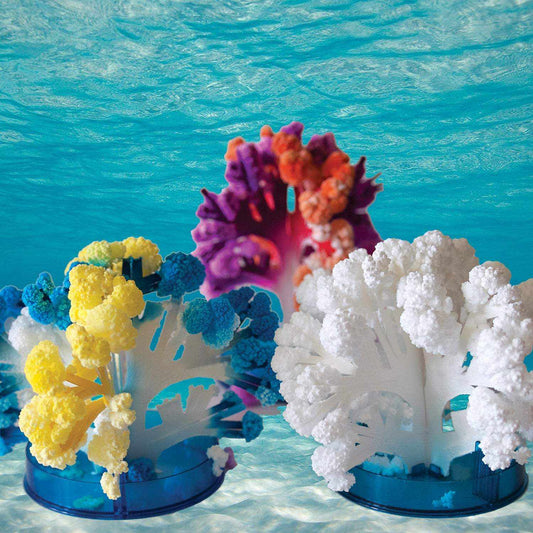 Colorful coral-like structures on blue stands against a blue water background