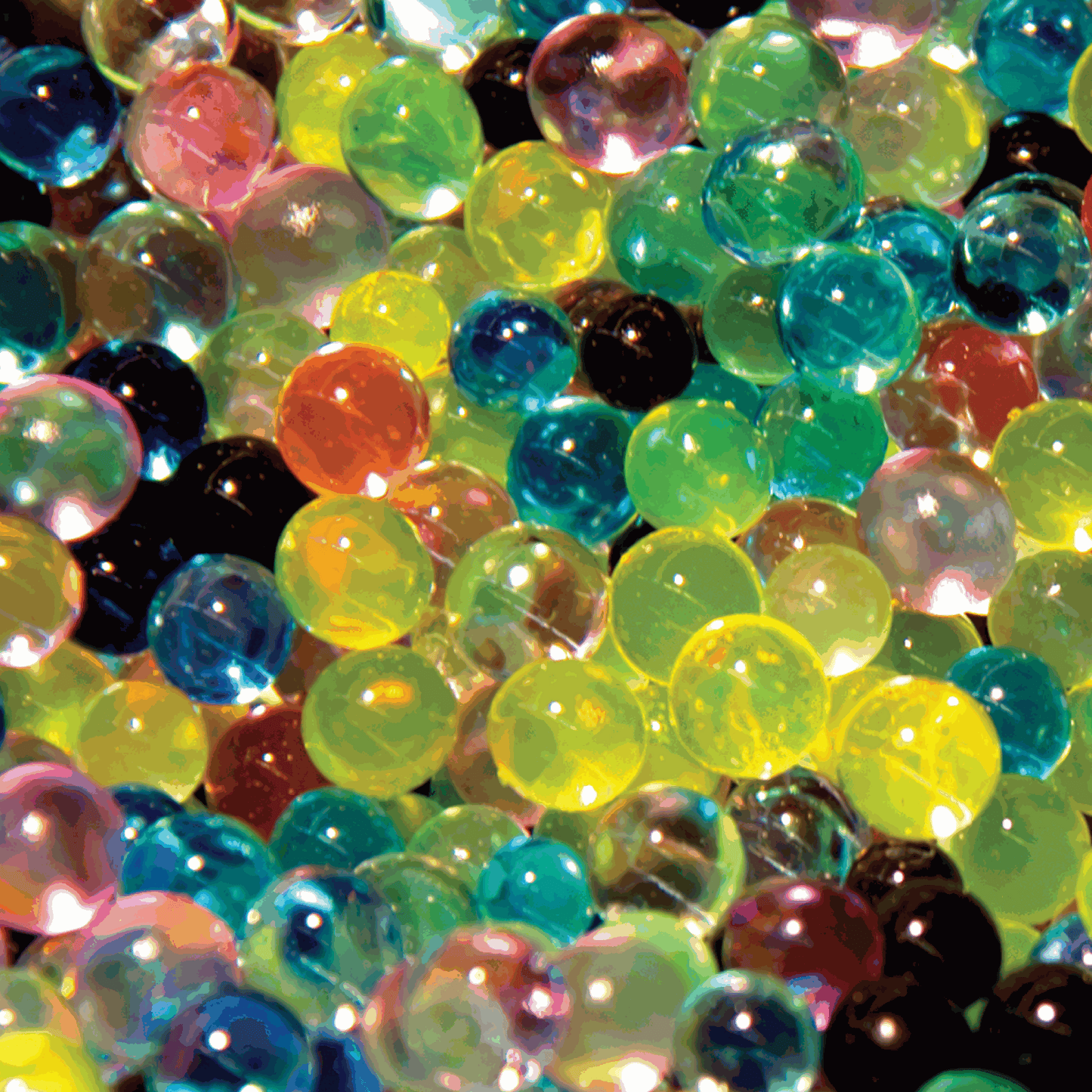 Close-up of colorful polymer spheres in various colors.
