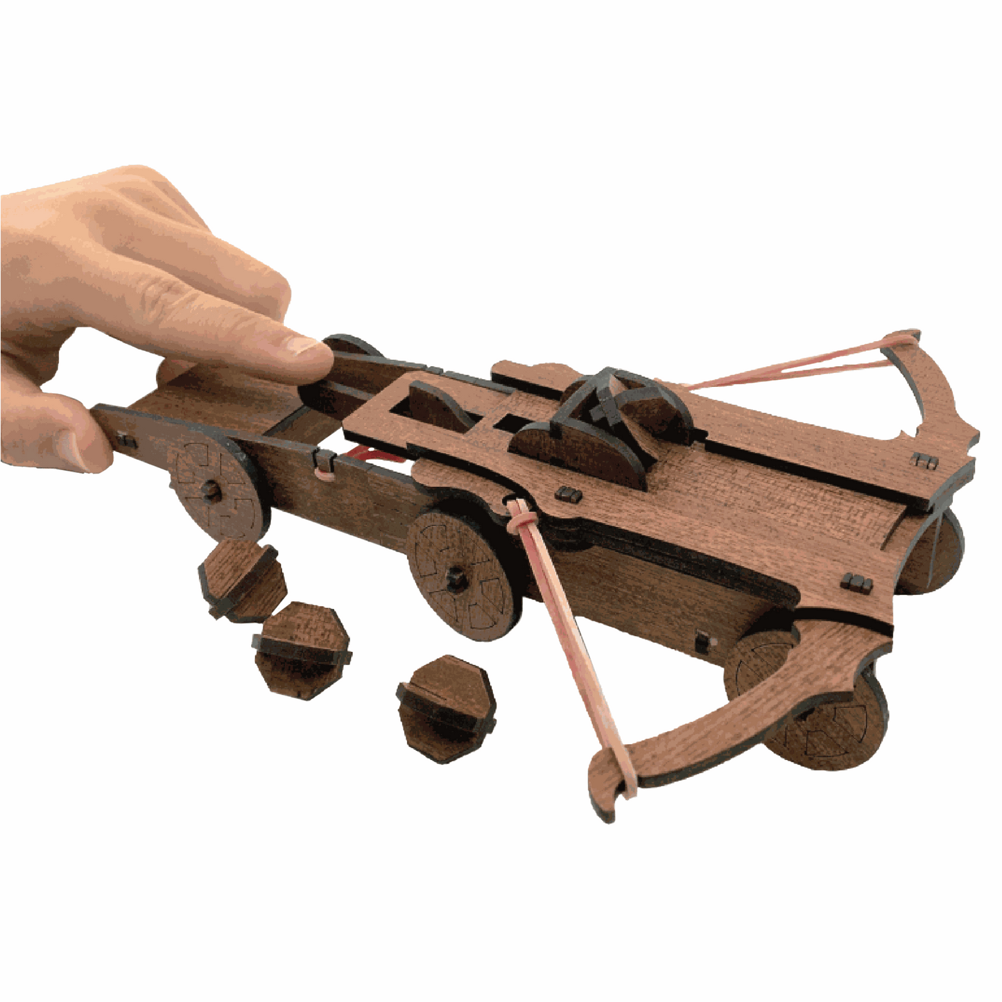 Wooden crossbow model with a hand interacting with it on a white background