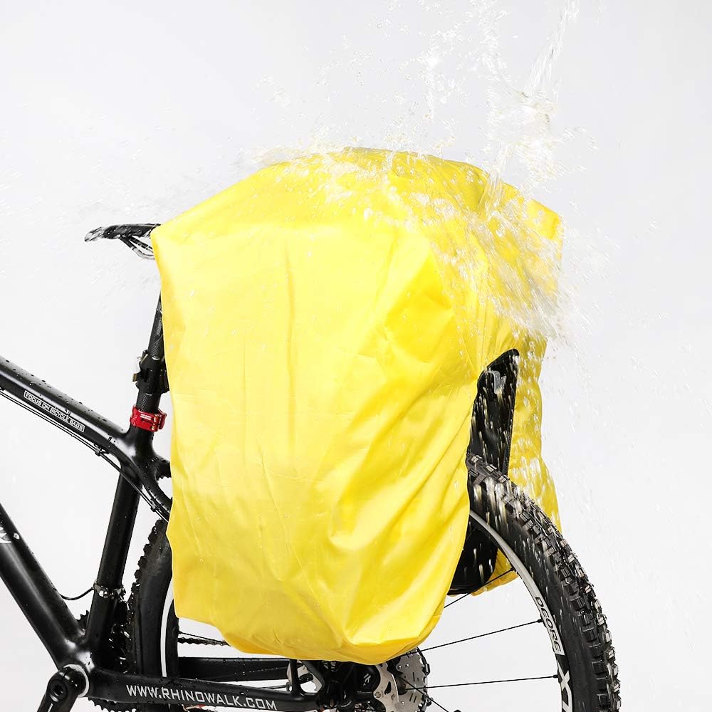 Yellow bike seat pack with water splashing over it on a white background