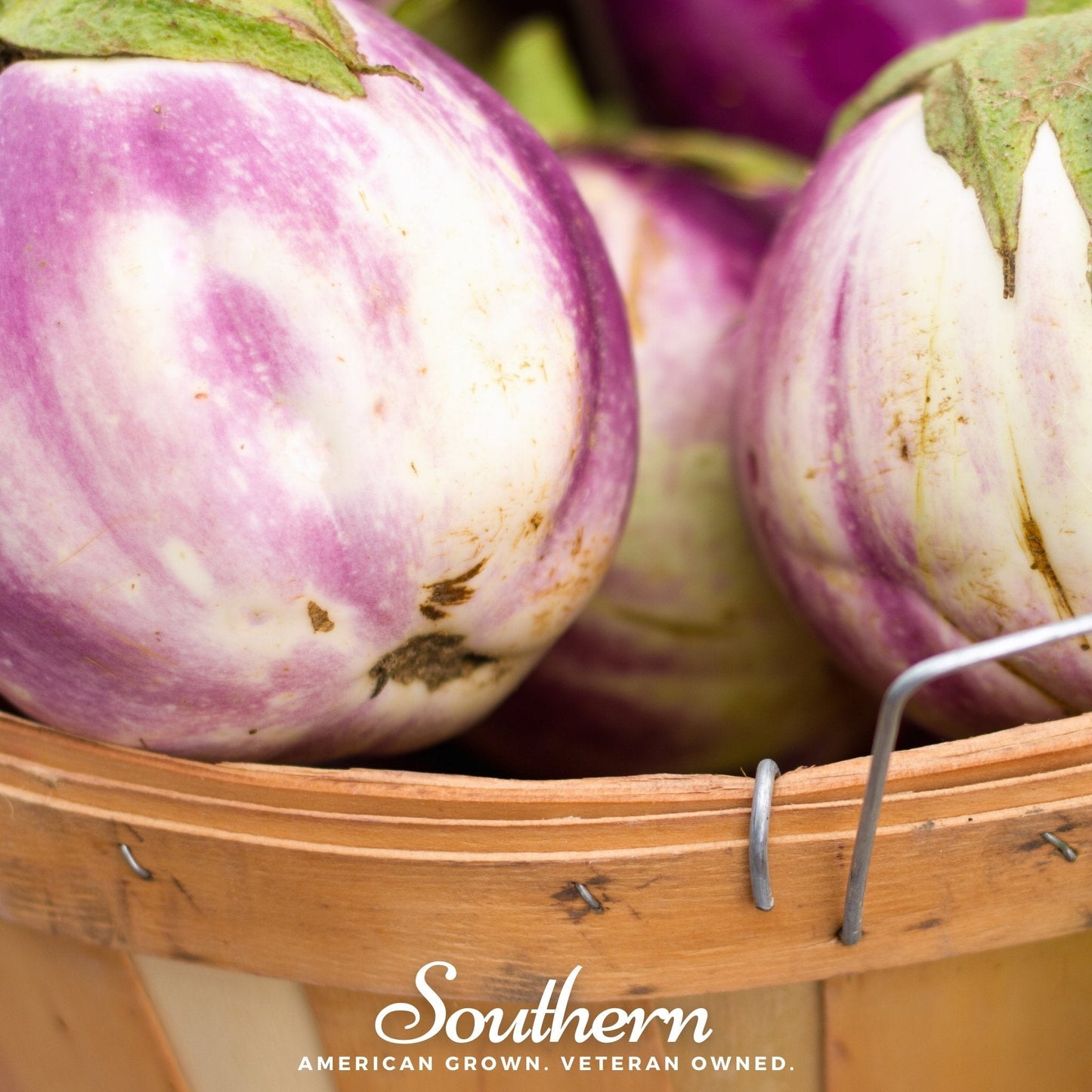 Basket of striped eggplants with 'Southern' brand text.