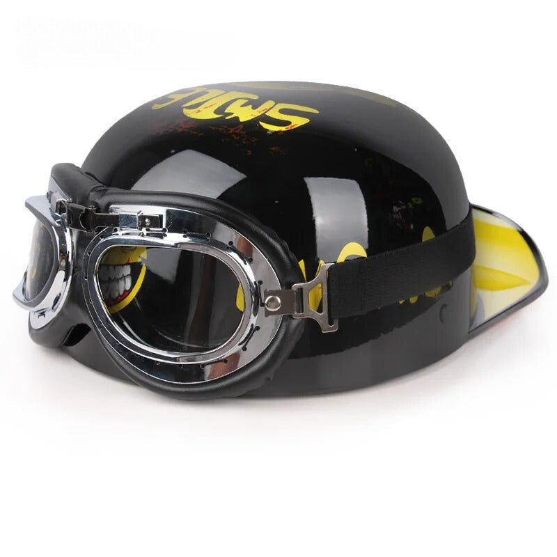 Black helmet with yellow accents and goggles on a white background