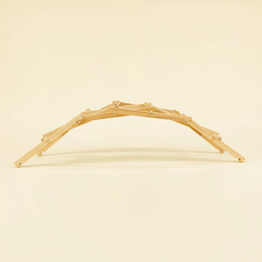 Wooden arch on a beige background