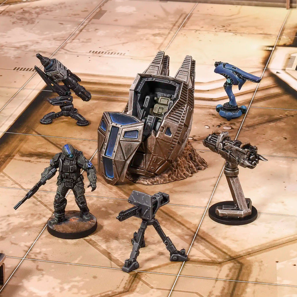 Collection of sci-fi miniature figures and models on a reflective surface