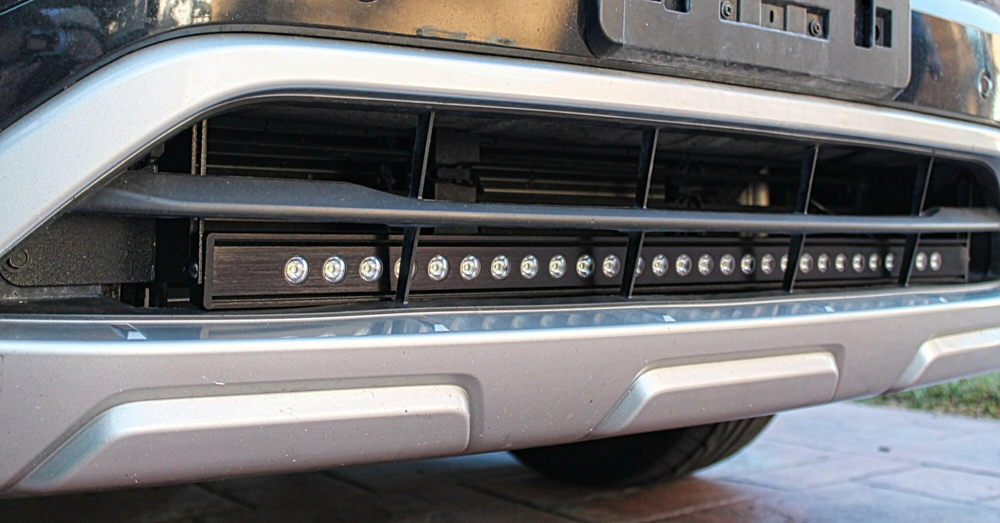 Close-up of a vehicle bumper with LED lights