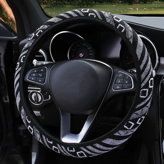 Steering wheel with a decorative cover inside a car