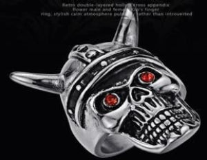 A stainless steel ring designed with a skull and crossbones motif, featuring red accents for eyes and a double-layered band.