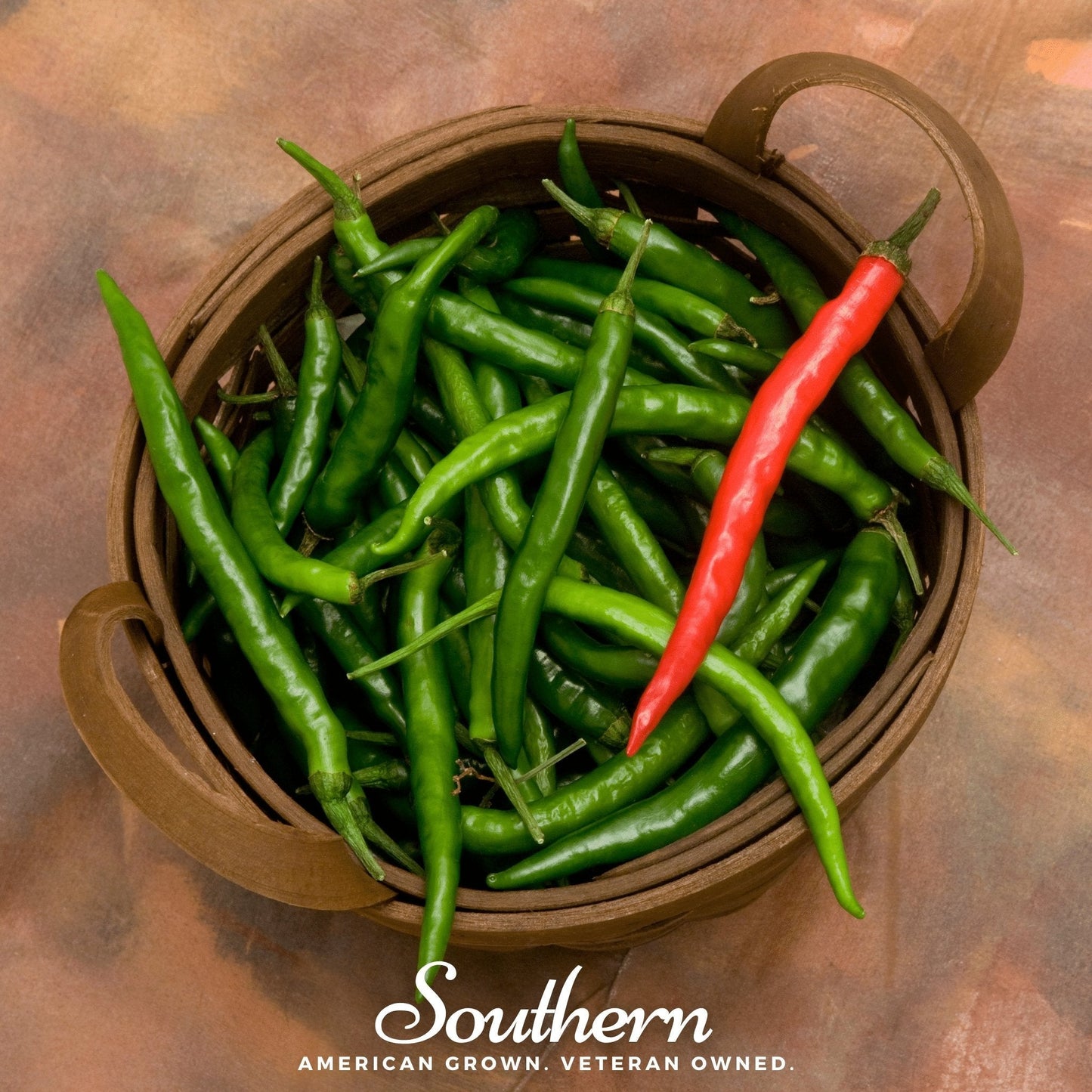 Basket of green chilies with a red chili pepper on a brown background, featuring the brand 'Southern'.