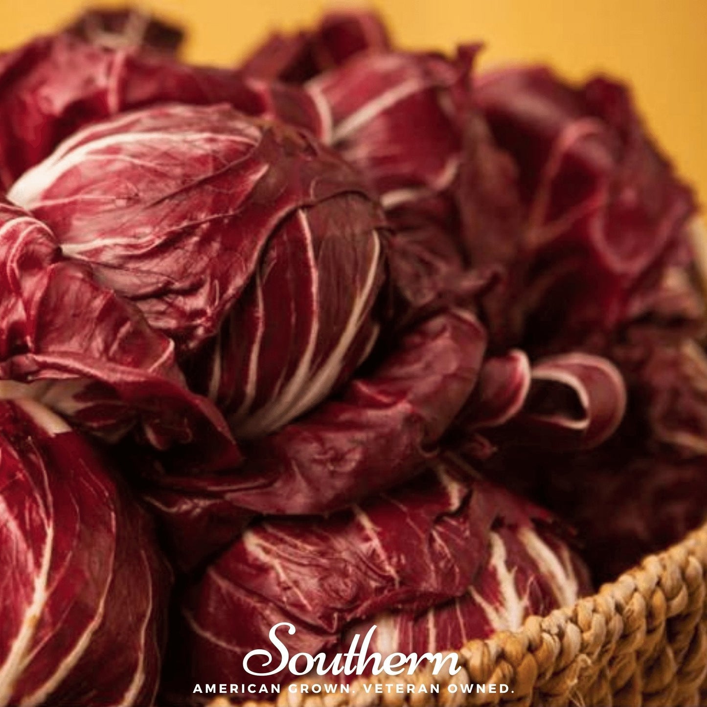 Red radicchio in a woven basket with 'Southern' branding on a yellow background