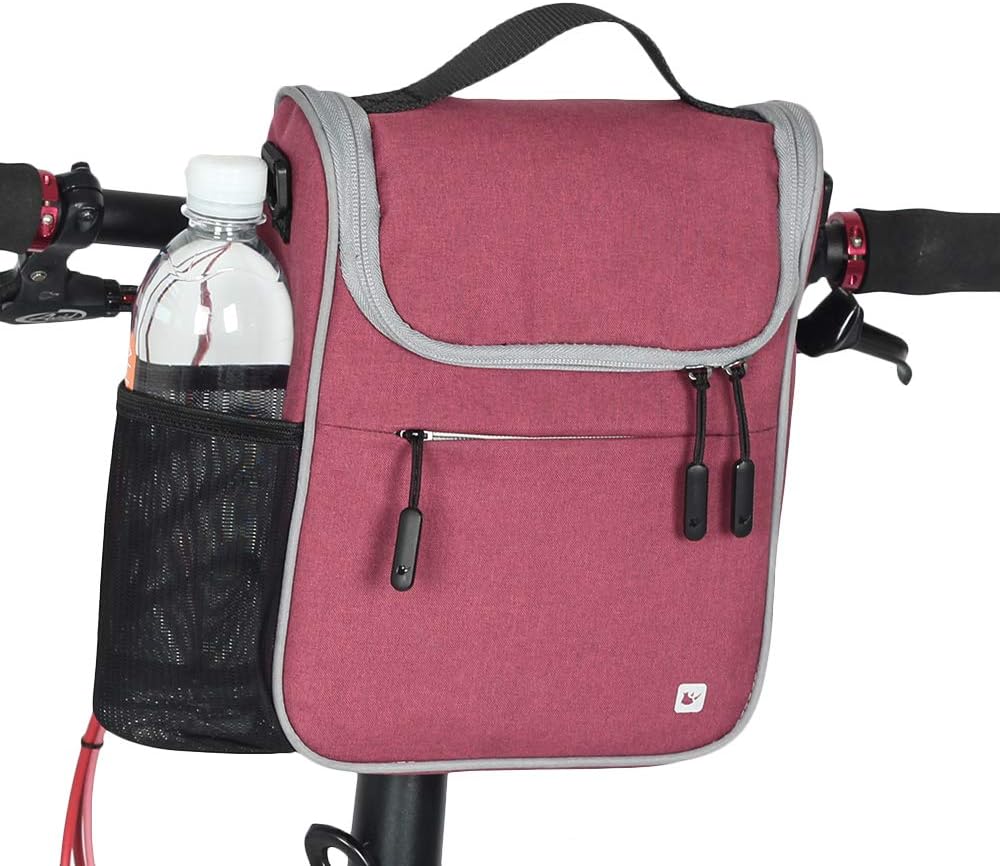 Pink bicycle bag with water bottle holder on a white background