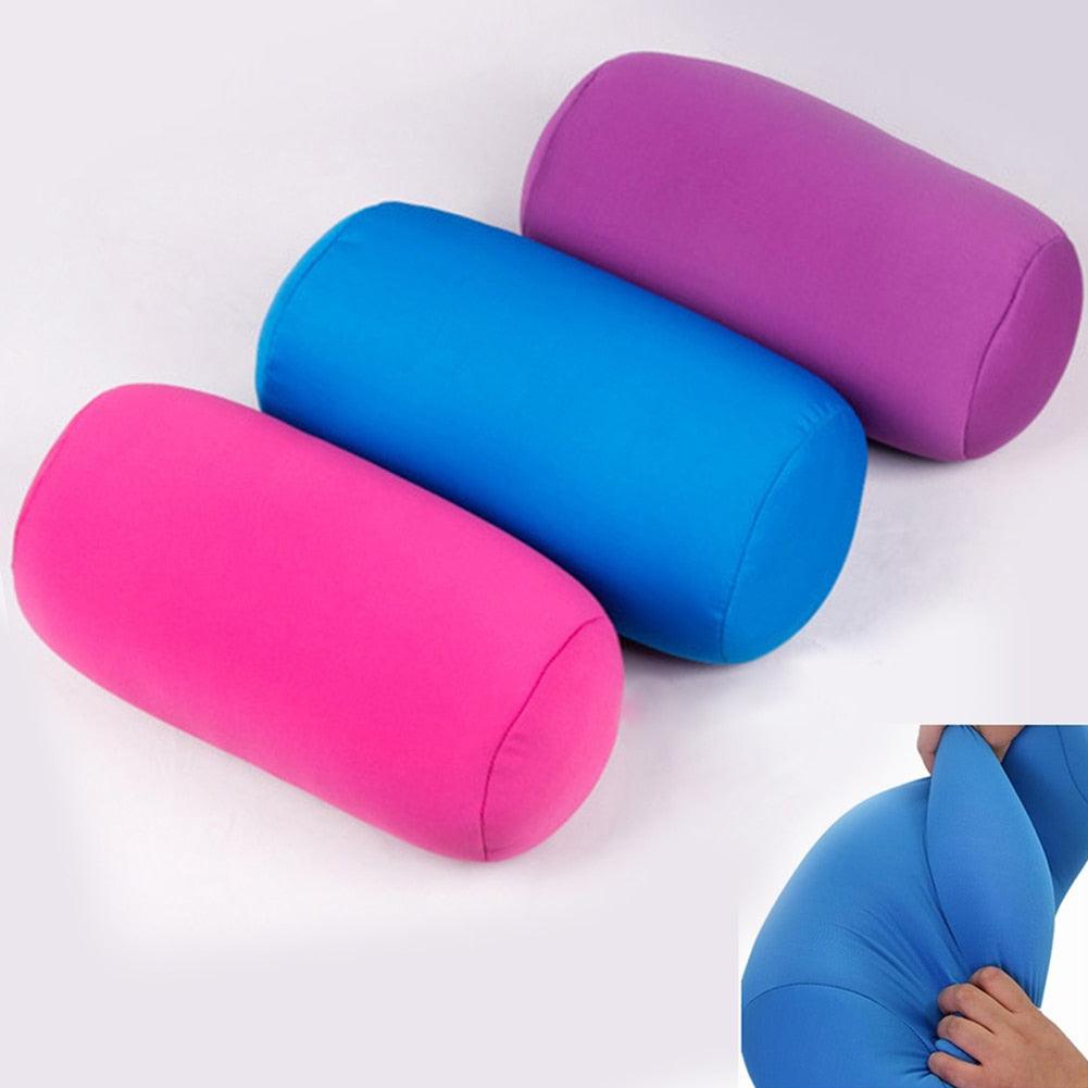 Three foam pillows in pink, blue, and purple on a white background.