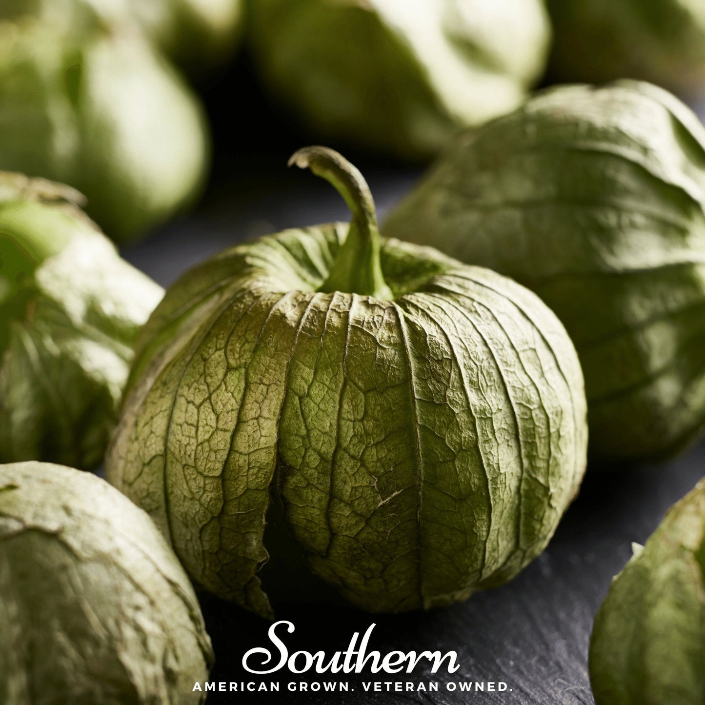 Close-up of green tomatillos with 'Southern' brand text.