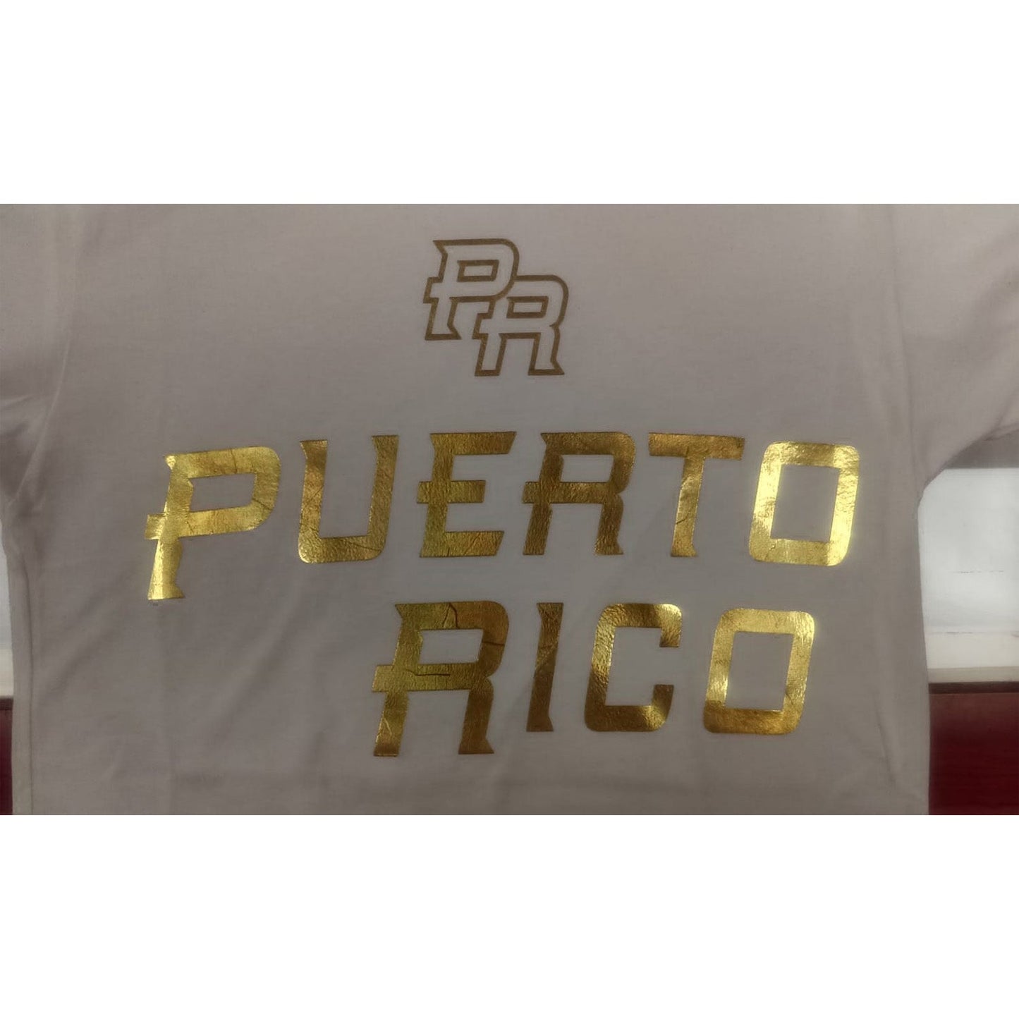 White shirt with gold 'PR' and 'Puerto Rico' text on a white background