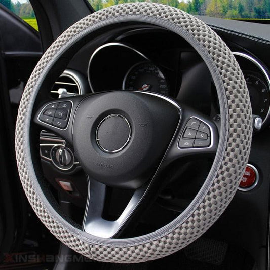 Car steering wheel with a textured cover inside a vehicle